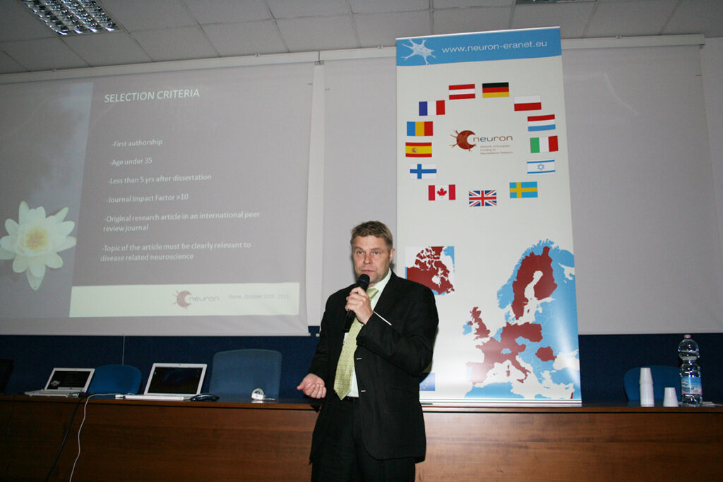Dr. Erkki Raulo giving a presentation