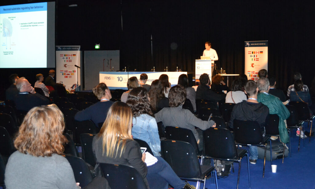 Dr. Julien Courtin speaking to the audience